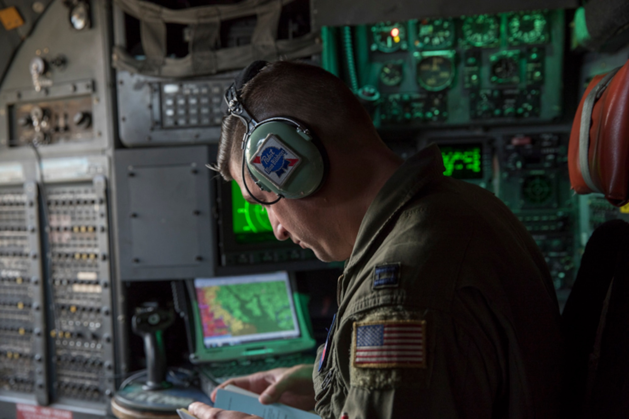 Capt. Andrew Kochman, 36th Airlift Squadron C-130H navigator, checks a route on a C-130H Hercules over the Kanto Plain, Japan, Oct. 5, 2017. This is the last active duty C-130H Hercules tactical training sortie.