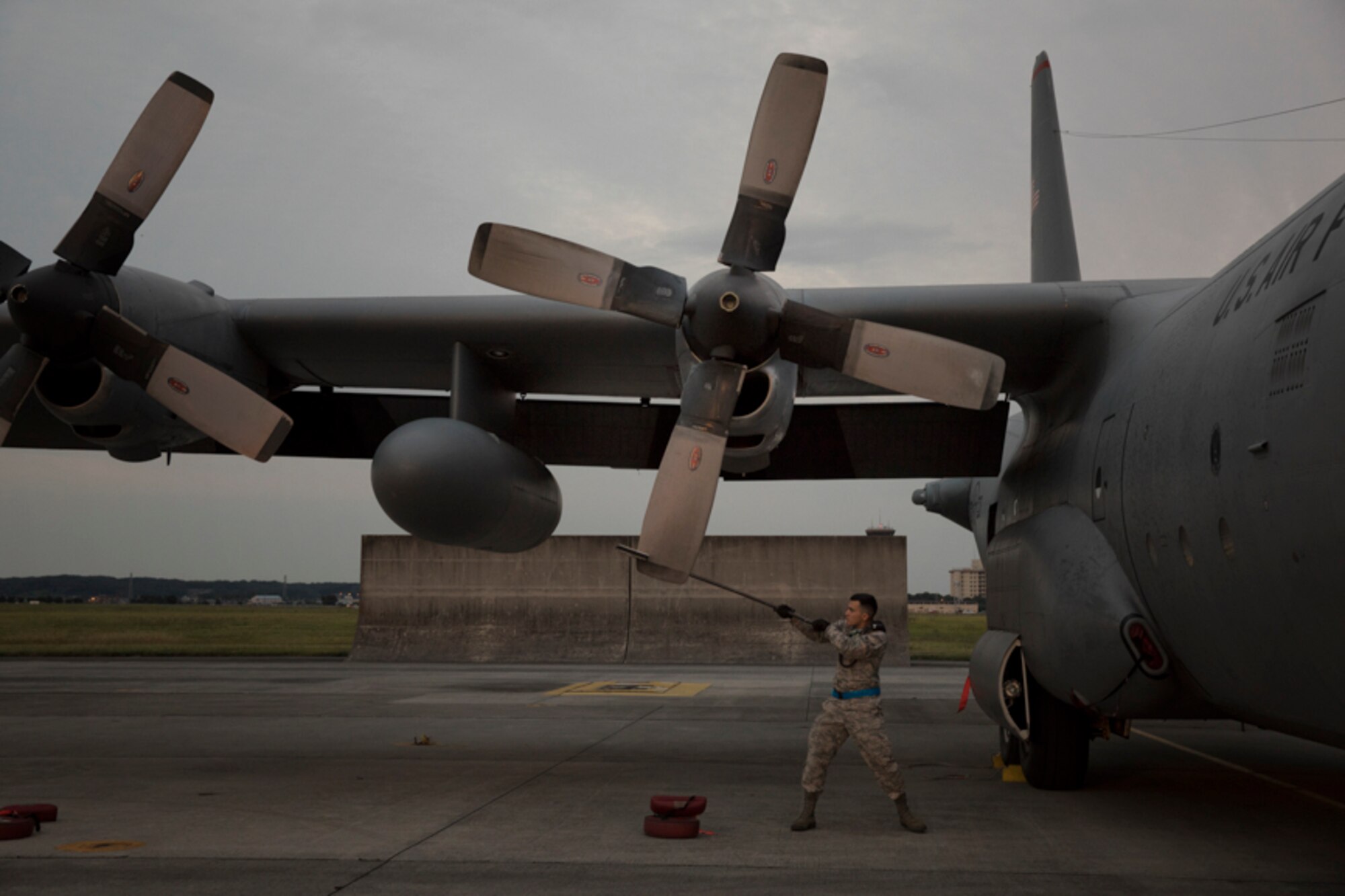 A crew chief from the 374th Aircraft Maintenance Squadron uses a prop stick to make sure the NO.2 blade is positioned in the T-position to prevent leaks on a C-130H Hercules at Yokota Air Base, Japan, Oct. 5, 2017. Crew members with the 36th Airlift Squadron completed the last active-duty C-130H tactical training sortie.