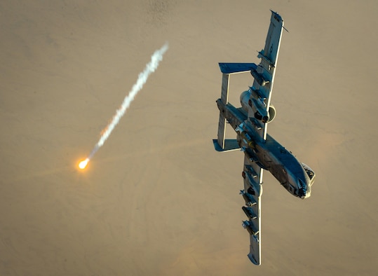 An A-10 Thunderbolt II shoots a flare off after receiving fuel from a 340th Expeditionary Air Refueling Squadron KC-135 Stratotanker in support of Operation Inherent Resolve Oct. 6, 2017. The aircraft can loiter near battle areas for extended periods of time and operate in low ceiling and visibility conditions. The wide combat radius, and short takeoff and landing capabilities, permit operations in and out of locations near front lines. (U.S. Air Force photo by Staff Sgt. Michael Battles)