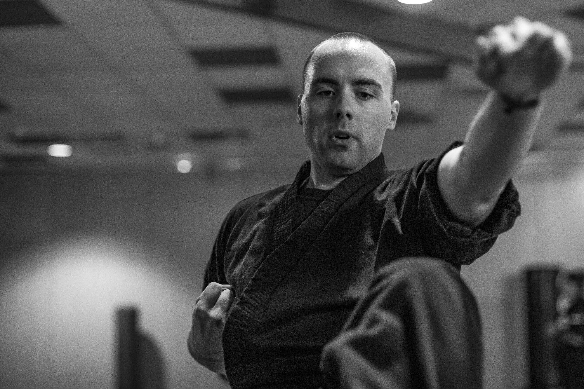 U.S. Air Force Staff Sgt. Brandon Sabin, 86th Airlift Wing Public Affairs broadcast journalist, practices forms during a mixed martial arts class at the Vogelweh Community Center on Vogelweh Military Complex, Germany, Oct. 11, 2017. Sabin has practiced five forms of martial arts over the course of 20 years. (U.S. Air Force photo by Senior Airman Devin Boyer)
