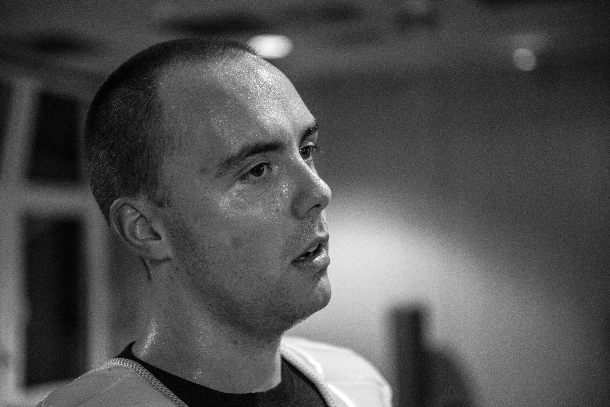 Sweat covers the face of U.S. Air Force Staff Sgt. Brandon Sabin, 86th Airlift Wing Public Affairs broadcast journalist, after a round of sparring during a mixed martial arts class at the Vogelweh Community Center on Vogelweh Military Complex, Germany, Oct. 11, 2017. Sabin said martial arts is an exhausting activity since it requires rigorous involvement of the whole body. (U.S. Air Force photo by Senior Airman Devin Boyer)
