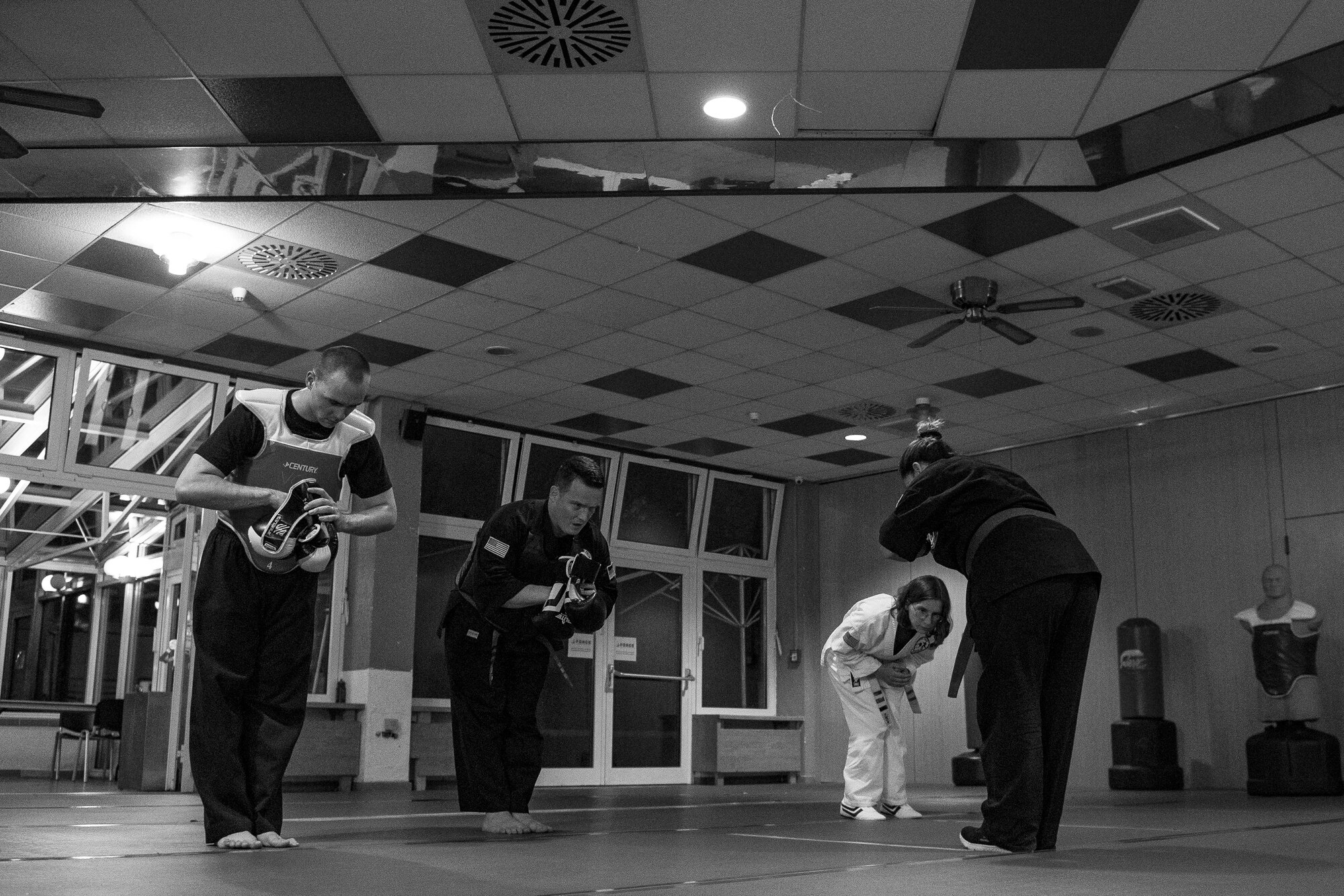 U.S. Air Force Staff Sgt. Brandon Sabin, 86th Airlift Wing Public Affairs broadcast journalist, bows with fellow students after a mixed martial arts class at the Vogelweh Community Center on Vogelweh Military Complex, Germany, Oct. 11, 2017. Sabin said that martial arts is a fantastic way to connect with the community. It also gives him opportunities to lead as he instructs the children’s self-defense classes. (U.S. Air Force photo by Senior Airman Devin Boyer)