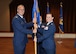 Col. Rick Johns, (Left) 88th Communications Group commander passes the 88th Communications Squadron guidon to Lt. Col. Kelly West, 88th Communications Squadron commander, as she assumes her new post as the commander during the change of command ceremony at Wright-Patterson Air Force Base, July 17, 2017. West assumes command from outgoing Lt. Col. Brian Snyder as he departs for his new assignment at the Pentagon, Washington D.C. (U.S. Air Force Photo  by Al Bright/Released)