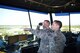 (Left) U.S. Air Force Tech. Sgt. Michael Crandall, 86th Operations Support Squadron air traffic control watch supervisor, looks through binoculars as (right) U.S. Air Force Staff Sgt. Matthew Macutkiewicz, 86th OSS air traffic control watch supervisor, points to an aircraft landing on Ramstein Air Base, Germany, Oct. 3, 2017. The past six months are busiest times for air traffic controllers but this team seemed to remain calm despite the stress these many aircraft operations could have caused. (U.S. Air Force photo by Airman 1st Class Kristof J. Rixmann)