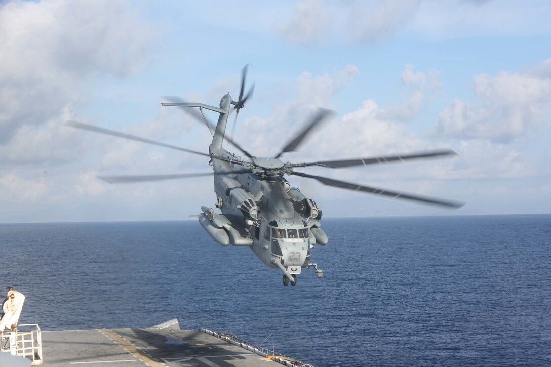 A U.S Marine Corps CH-53E Super Stallion  with Marine Medium Tiltrotor Squadron (VMM) 162 (Reinforced), 26th Marine Expeditionary Unit (MEU), departs the amphibious assault ship USS Kearsarge (LHD 3) in the Caribbean Sea, Oct. 12, 2017.