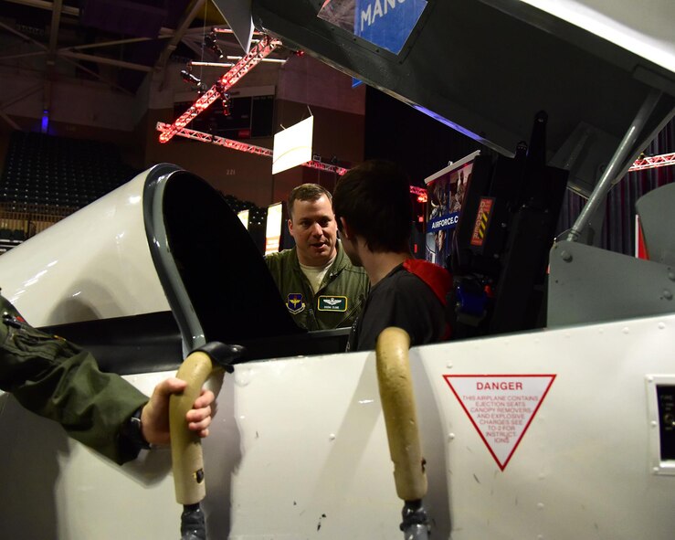 Lt. Col. Michael Cline, 14th Force Support Squadron Deputy Commander, talks with a student Oct. 4, 2017, during the Imagine the Possibilities Career Expo at the BancorpSouth Arena in Tupelo, Mississippi. The expo was hosted by the CREATE Foundation and was sponsored by more than 150 organizations. (U.S. Air Force photo by Elizabeth Owens)