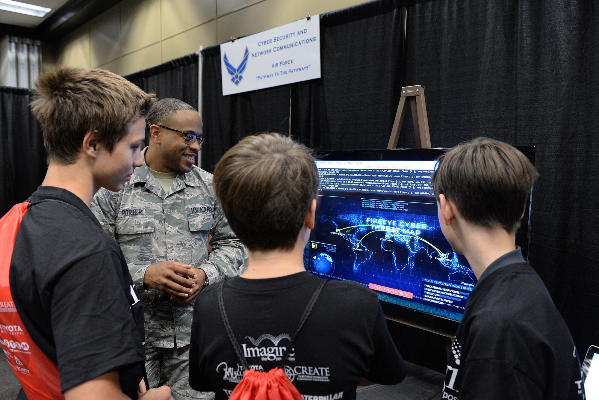Staff Sgt. Donald Porter, 14th Communication Squadron technician, explains the mission of the U.S. Air Force’s communications career field Oct. 4, 2017, at Imagine the Possibilities Career Expo at the BancorpSouth Arena in Tupelo, Mississippi. Several Air Force careers were displayed in various ways and Airmen explained to students from schools across Mississippi what opportunities the Air Force can provide. (U.S. Air Force photo by Airman 1st Class Keith Holcomb)