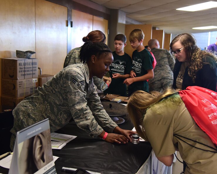 Senior Airman Brianna Brown, 14th Medical Operations Squadron public health technician, talks with students Oct. 3, 2017, during the Imagine the Possibilities Career Expo at the BancorpSouth Arena in Tupelo, Mississippi. Airmen from Columbus Air Force Base, Mississippi, showcased a total of 21 careers at the expo. (U.S. Air Force photo by Elizabeth Owens)