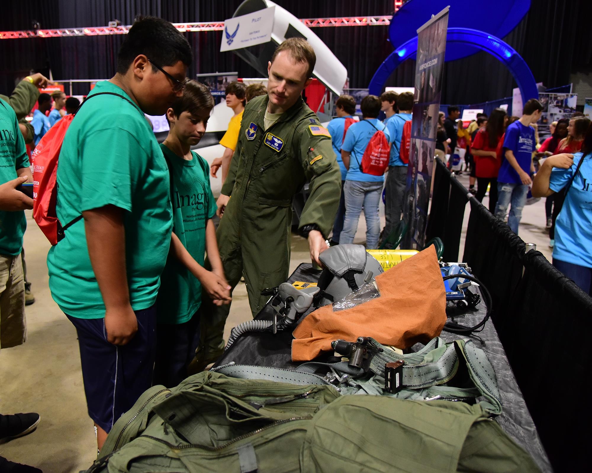 Capt. Andrew Richter, 37th Flying Training Squadron Commander’s Executive Assistant, talks with students Oct. 4, 2017, during the Imagine the Possibilities Career Expo at the BancorpSouth Arena in Tupelo, Mississippi. Airmen from Columbus Air Force Base, Mississippi, represented seven pathways showcasing 21 careers. (U.S. Air Force photo by Elizabeth Owens)