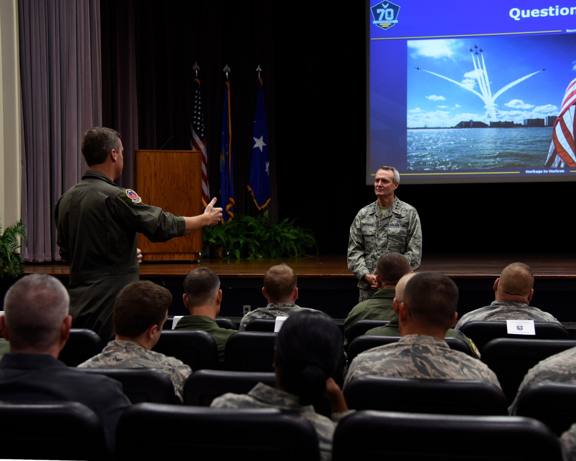 Lt. Gen. Darryl L. Roberson, commander of Air Education and Training Command, converses with 14th Flying Training Wing leadership during an AETC Senior Leader All-Call Oct. 5, 2017, on Columbus Air Force Base, Mississippi.  Roberson and AETC Command Chief Master Sergeant Juliet C. Gudgel spoke about future changes and ideas that can be implemented throughout their bases, groups and squadrons to more efficiently lead their students and Airmen.