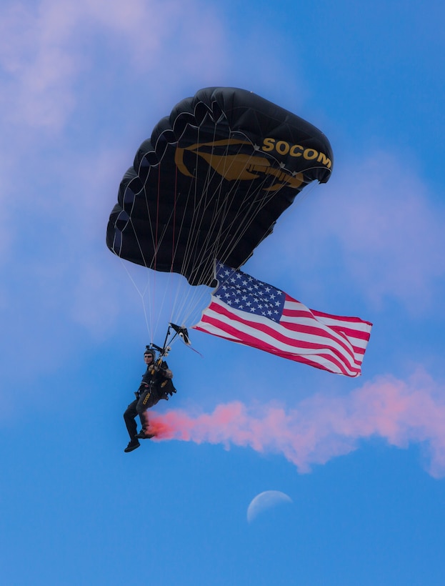 A Para-Commando of the United States Special Operations Command Parachute Team drops in over MacDill Air Force Base, October 13, 2017. The Para-Commandos are the U.S. Special Operations Command's premier aerial parachute demonstration team. (Department of Defense photo by Tom Gagnier)