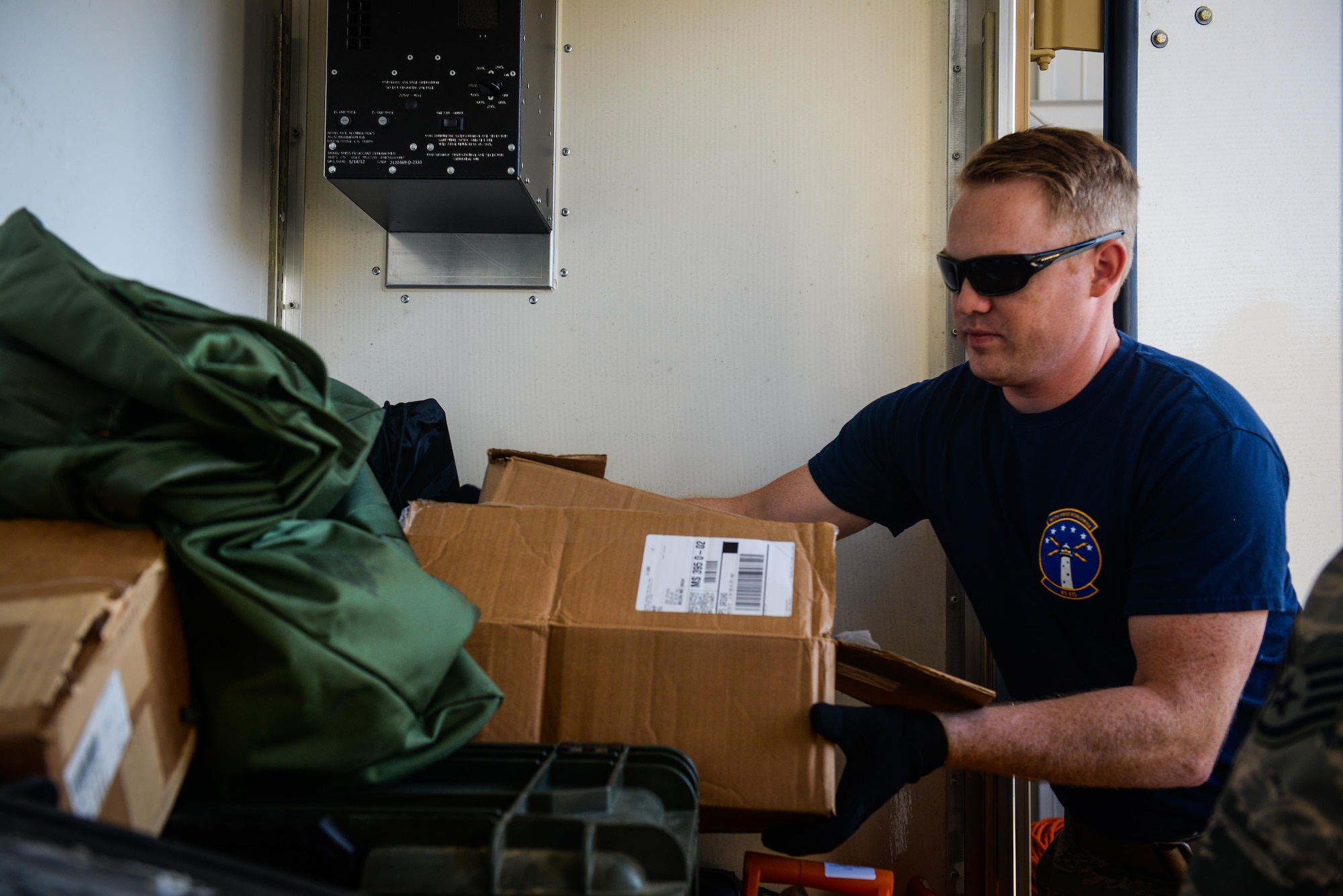 Staff Sgt. Skyler Hart, 85th Engineering Installation Squadron quality assurance, loads equipment into a cargo container for a deployment to aid Puerto Rico at the 85th EIS Vehicle Operations building on Keesler Air Force Base, Mississippi. In the wake of Hurricane Maria, Puerto Rico’s land mobile radio communications infrastructure for first responders are in dire need of repair and the 85th EIS were requested by name to help get it back up and running. (U.S. Air Force photo by Senior Airman Travis Beihl)