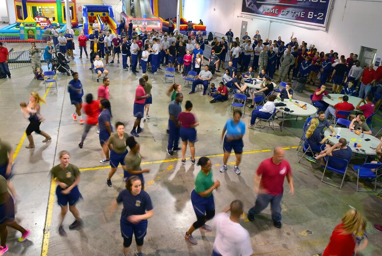 Members of Team Whiteman dance to the Electric Slide prior to the culmination ceremony for the 2017 Comprehensive Airman Fitness Day at Whiteman Air Force Base, Mo., Oct. 6, 2017.