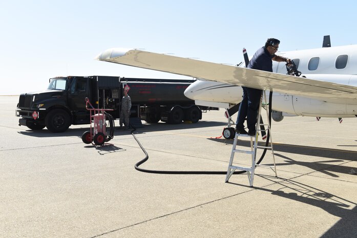 Staff Sgt. Mathew Stone, 9th Logistics Readiness Squadron fuels distribution, and Albert Goodly 9th Mission Support Group aircraft repairman, refuel a California  Air National Guard RC-26 aircraft at Beale Air Force Base, California