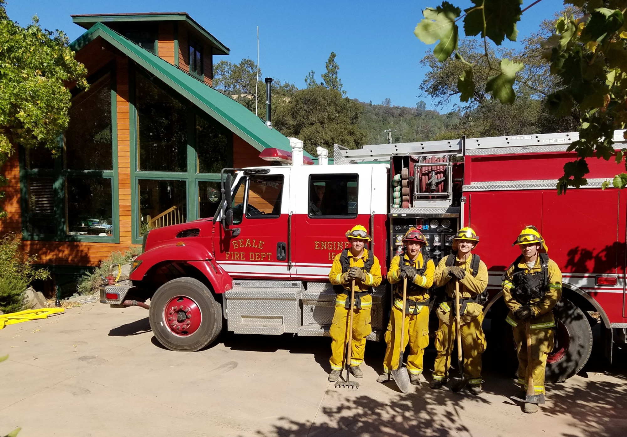 Firefighters from the 9th Civil Engineer Squadron stand by their fire engine during the California wildfires.