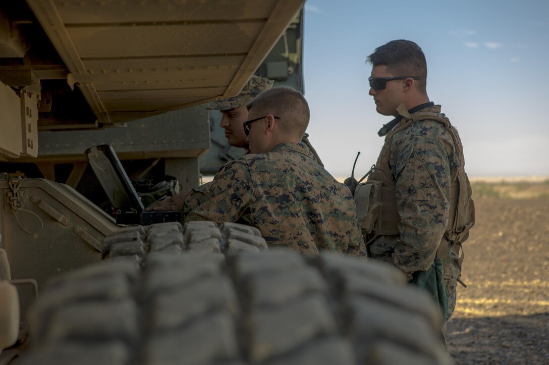 Marines with 3rd Platoon, Rocket Battery F, 2nd Battalion, 14th Marine Regiment, Marine Forces Reserve, review a function checklist of an M142 High Mobility Artillery Rocket System during Weapons and Tactics Instructor course 1-18 at Landing Zone Bull Attack, near the Chocolate Mountain Aerial Gunnery Range, California, Oct. 11, 2017.
