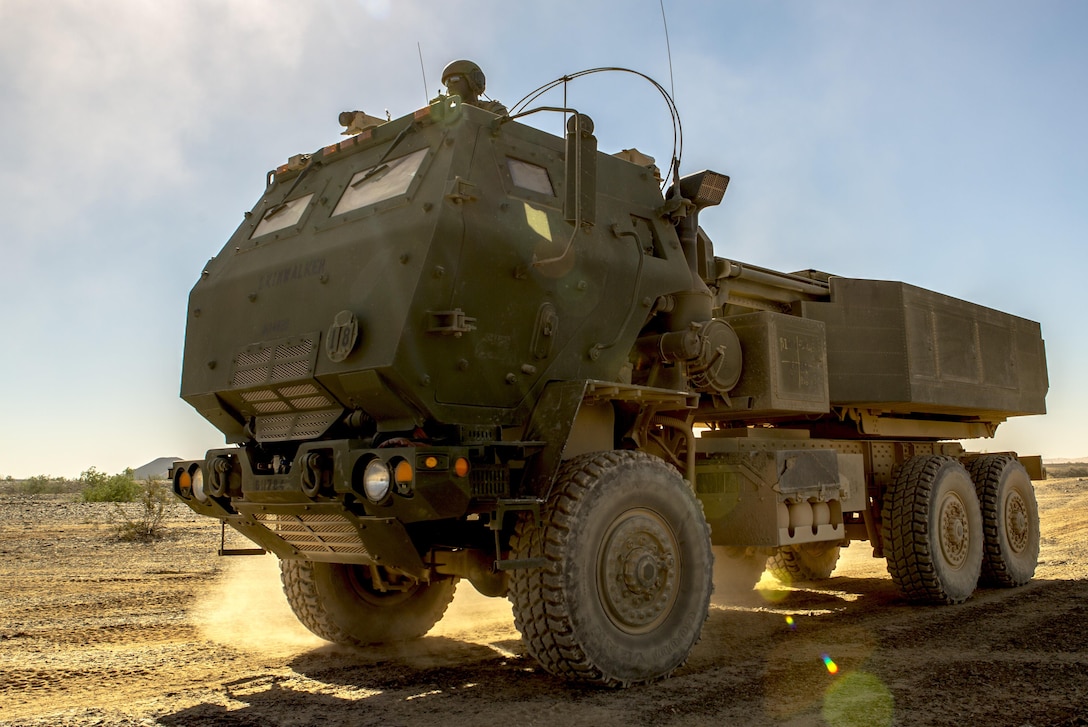 Sgt. Nathanael Izu, a section chief with 3rd Platoon, Rocket Battery F, 2nd Battalion, 14th Marine Regiment, Marine Forces Reserve, guides the driver of an M142 High Mobility Artillery Rocket System during Weapons and Tactics Instructor course 1-18 at Landing Zone Bull Attack, near the Chocolate Mountain Aerial Gunnery Range, California, Oct. 11, 2107.