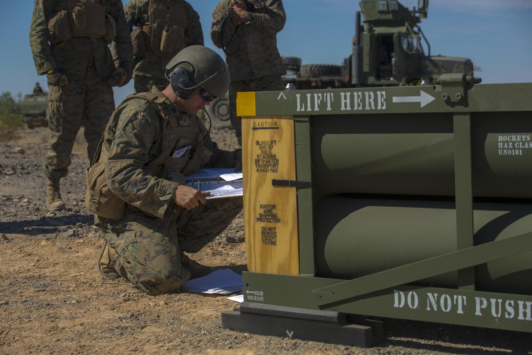 Sgt. Jansen Davis, a section chief with 3rd Platoon, Rocket Battery F, 2nd Battalion, 14th Marine Regiment, 4th Marine Division, Marine Forces Reserve, records the serial numbers and launch codes of Guided Multiple Launch Rocket Systems munitions during Weapons and Tactics Instructor course 1-18 at Landing Zone Bull Attack, near the Chocolate Mountain Aerial Gunnery Range, California, Oct. 11, 2017.