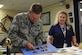 U.S. Air Force Col. Scott Campbell, 355th Fighter Wing commander, constructs a matte board photo overlay at Davis-Monthan Air Force Base, Ariz., Oct. 13, 2017. Campbell spent his morning performing various tasks with the 355th Force Support Squadron as part of a unit immersion. (U.S. Air Force photo by Airman 1st Class Frankie D. Moore)