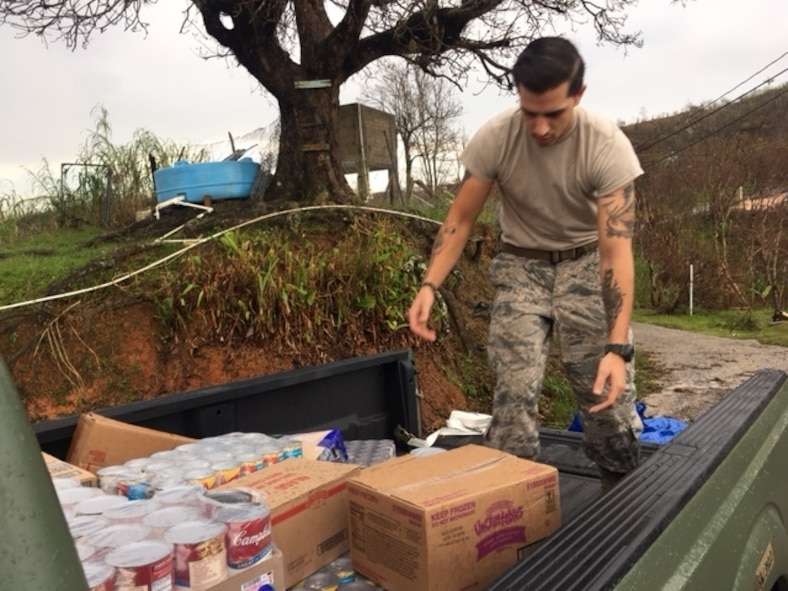 An Airman helps deliver food and water to local villages during Hurricane Maria relief efforts, Ponce, Puerto Rico. (Courtesy Photo)