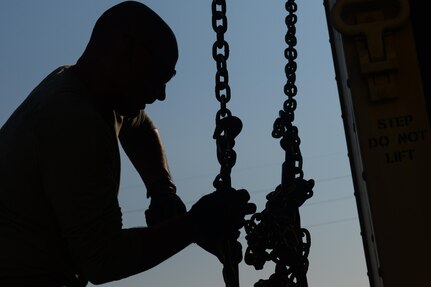 Staff Sgt. Victor Mancaruso, 85th Engineering Installation Squadron vehicle operator, secures a cargo container for a deployment to aid Puerto Rico at the 85th EIS Vehicle Operations building on Keesler Air Force Base, Mississippi. In the wake of Hurricane Maria, Puerto Rico’s land mobile radio communications infrastructure for first responders are in dire need of repair and the 85th EIS were requested by name to help get it back up and running. (U.S. Air Force photo by Senior Airman Travis Beihl)