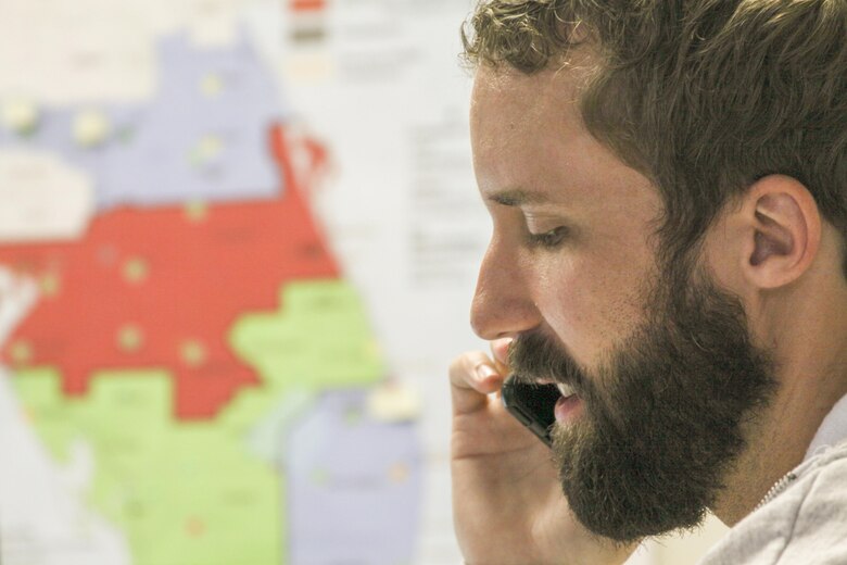 TAMPA, Fla. -- Charlie Thomason, the mission manager for Operation Blue Roof, takes a call at the Tampa Recovery Field Sept. 29, 2017. In disaster areas, Operation Blue Roof is a program for homeowners who have damage to their roofs. The program sends licensed contractors out to homes to cover the damage with fiber-reinforced plastic sheeting until residents can arrange repairs. As mission manager, Thomason was in charge of more than 280 Corps employees and 70,000 rolls of blue plastic sheeting.  (U.S. Army photo/Kerry Solan)