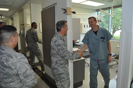 Maj. Gen. Randall Ogden, 4th Air Force commander, meets Maj. Jered King, 433rd Aerospace Medical Squadron dentist, during his visit to the Air Force Postgraduate Dental School & Clinic Oct. 14, 2017. Gen. Ogden, along with Chief Master Sgt. Timothy White, Jr., 4th AF command chief, spent four days visiting with the 433rd Airlift Wing's Citizen Airmen and receiving a first-hand look at the Alamo Wing's operations within Joint Base San Antonio. (U.S. Air Force photo/Senior Airman Bryan Swink)