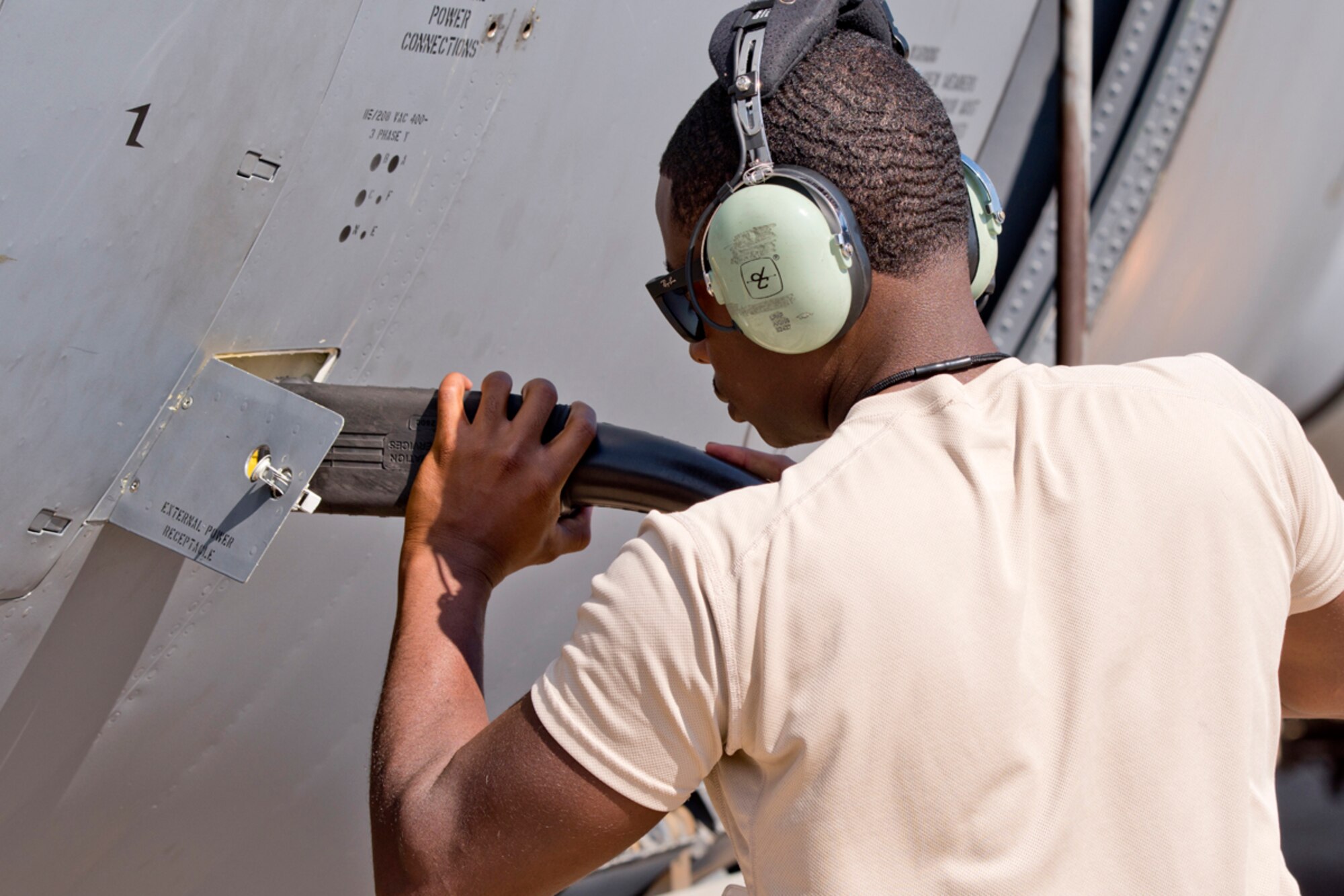 U.S. Air Force Reserve Staff Sgt. Kquawmae Akins, crew chief, 913th Maintenance Squadron, connects external power to a C-130J Super Hercules Oct. 14, 2017, at Little Rock Air Force Base, Ark.