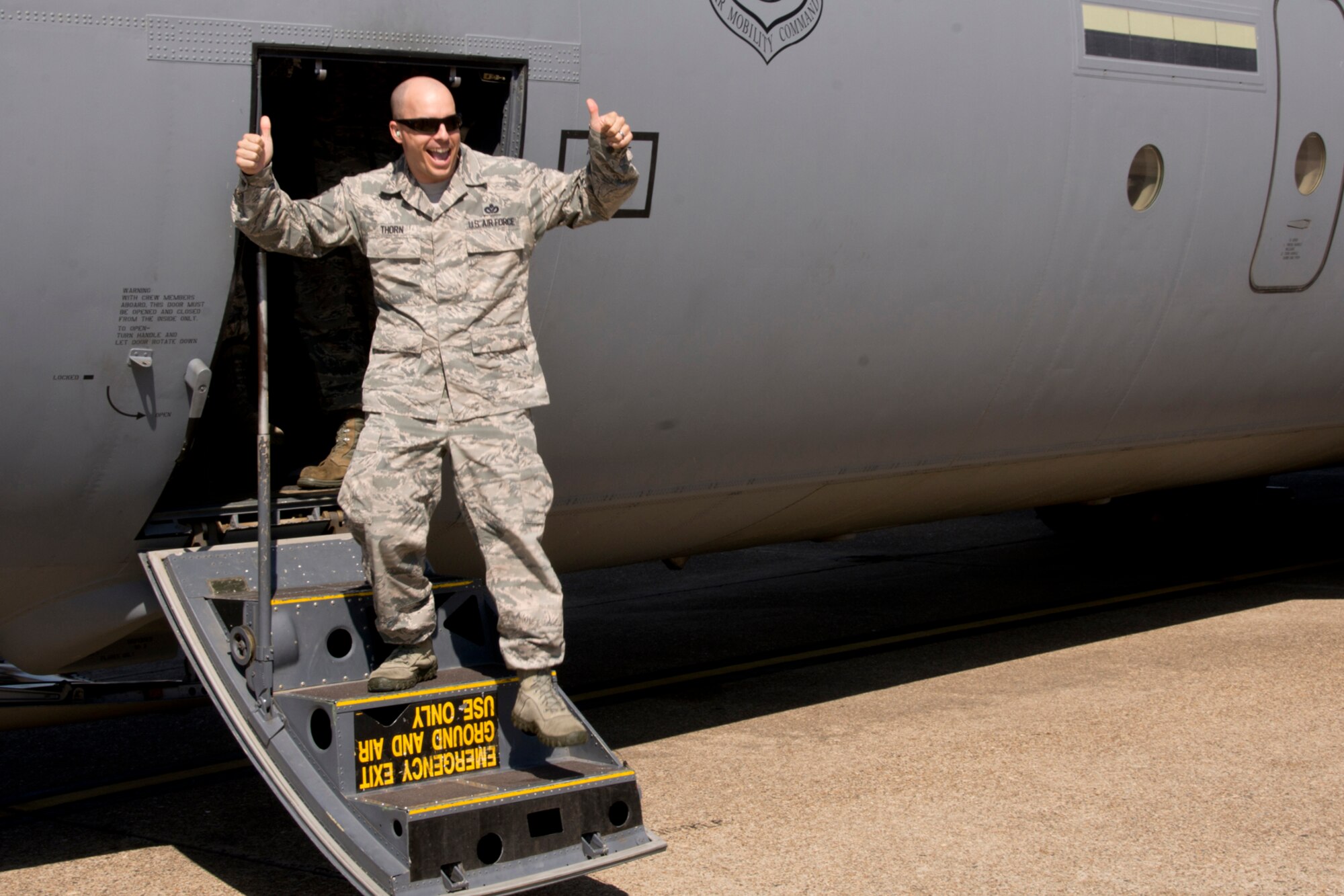 U.S. Air Force Reserve Master Sgt. Nathan Thorn, line recruiter, Air Force Reserve Command, gives a thumbs up as he deplanes after an incentive ride in a C-130 Super Hercules Oct. 14, 2017, at Little Rock Air Force Base, Ark.