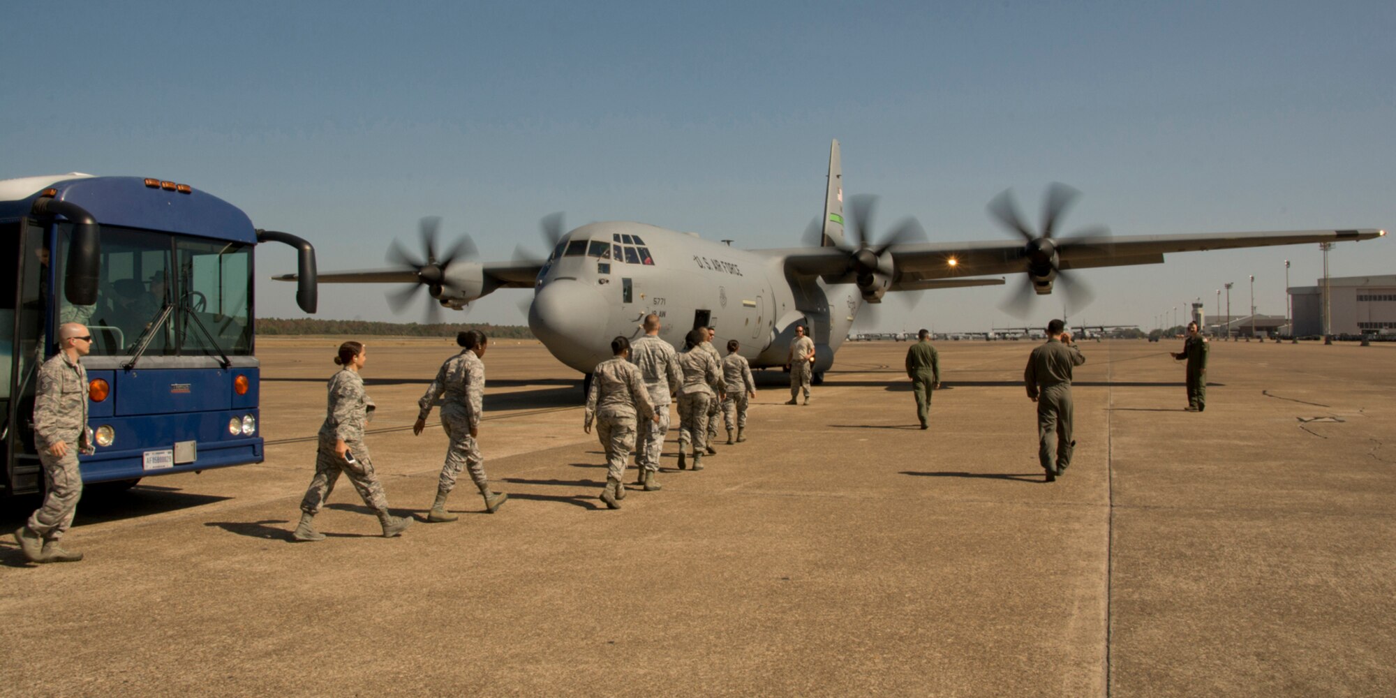 U.S. Air Force Reserve Airmen make their way to a C-130J Super Hercules during an Engines Running Onload/Offload event Oct. 14, 2017, at Little Rock Air Force Base, Ark.