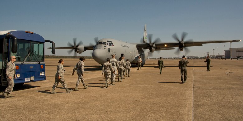 U.S. Air Force Reserve Airmen make their way to a C-130J Super Hercules during an Engines Running Onload/Offload event Oct. 14, 2017, at Little Rock Air Force Base, Ark.