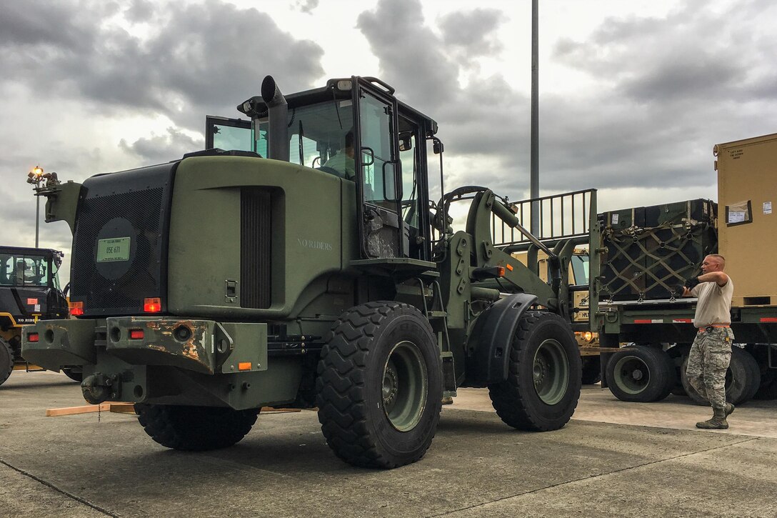 Airmen from the Kentucky Air National Guard’s 123rd Contingency Response Group, augmented by troops from the active-duty Air Force and Air National Guard units in multiple states, load relief supplies onto trucks for distribution at Luis Muñoz Marín International Airport in San Juan, Puerto Rico, in the wake of Hurricane Maria Oct. 5, 2017. The unit’s Airmen established an aerial port of debarkation upon arrival here Sept. 23, and have processed more than 7.2 million pounds of cargo and humanitarian aid for distribution in the first three weeks of the operation. (U.S. Air National Guard photo by Lt. Col. Dale Greer)