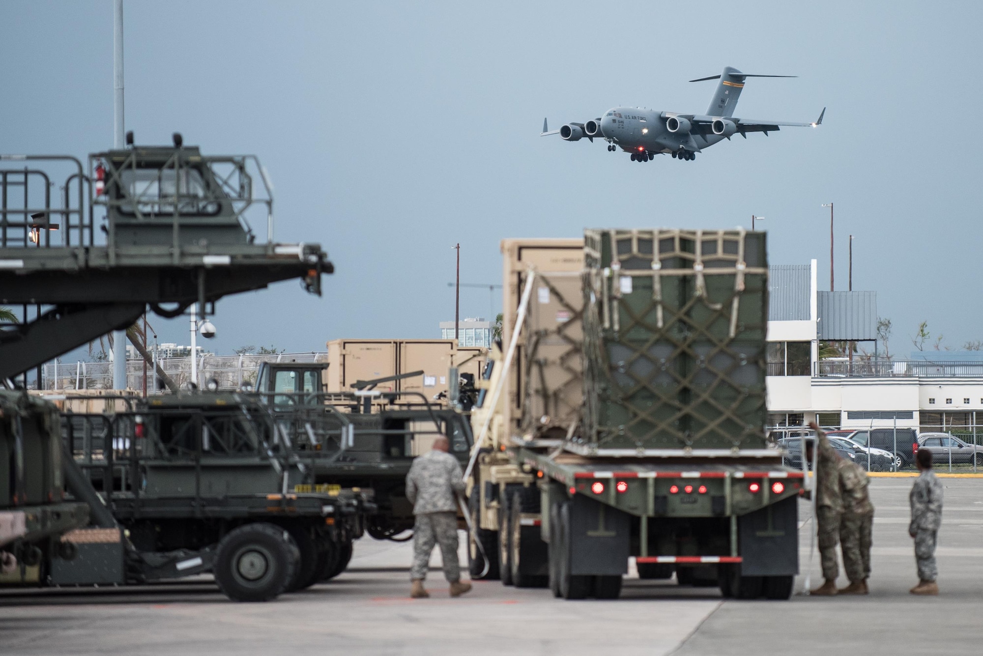 Airmen from the Kentucky Air National Guard’s 123rd Contingency Response Group, augmented by troops from the active-duty Air Force and Air National Guard units in multiple states, load relief supplies onto trucks for distribution at Luis Muñoz Marín International Airport in San Juan, Puerto Rico, in the wake of Hurricane Maria Oct. 5, 2017. The unit’s Airmen established an aerial port of debarkation upon arrival here Sept. 23, and have processed more than 7.2 million pounds of cargo and humanitarian aid for distribution in the first three weeks of the operation. (U.S. Air National Guard photo by Lt. Col. Dale Greer)
