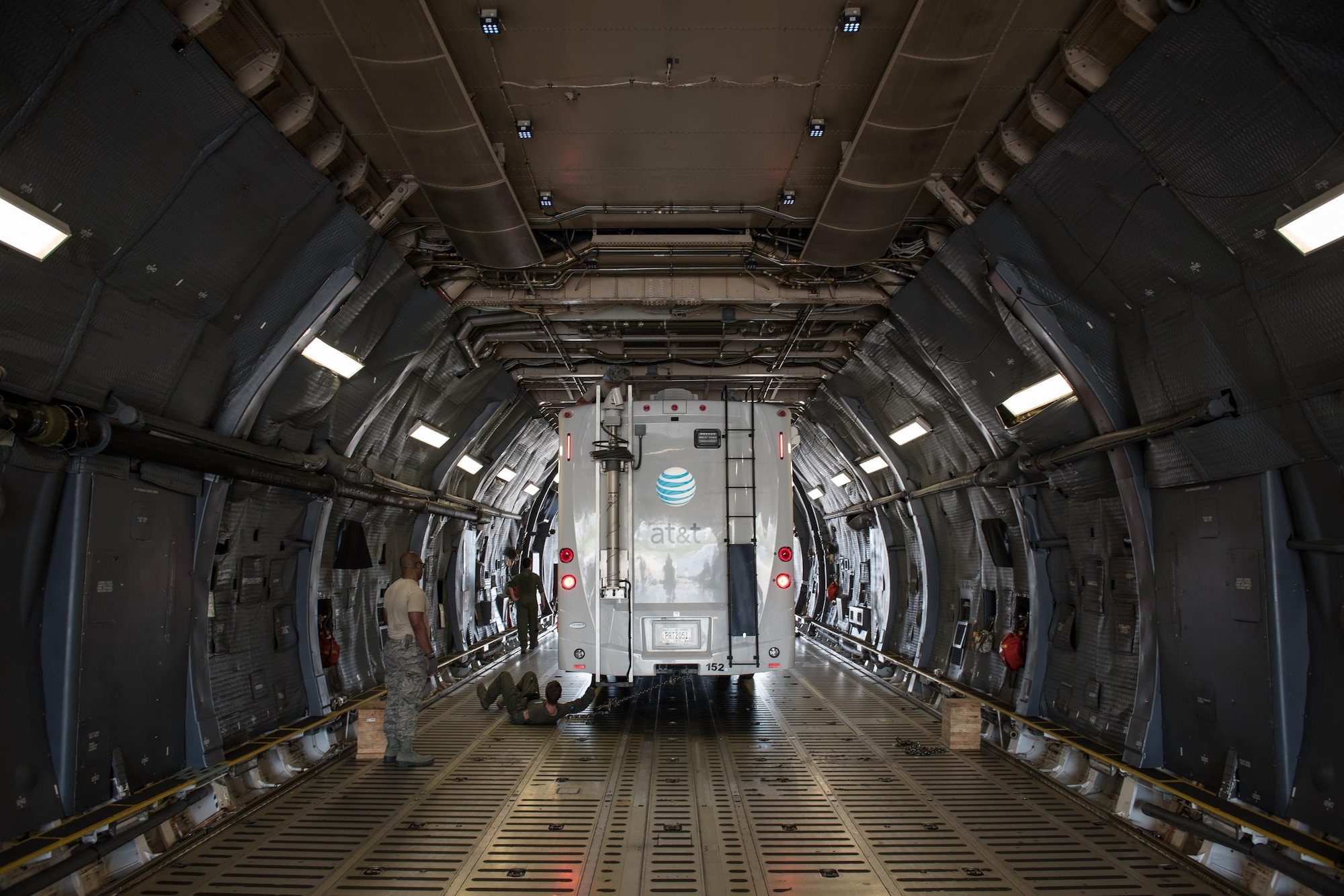 Members of the Kentucky Air National Guard’s 123rd Contingency Response Group, augmented by Airmen from the active-duty Air Force and Air National Guard units in multiple states, download a mobile cell-phone tower truck from a U.S. Air Force C-5 Galaxy at Luis Muñoz Marín International Airport in San Juan, Puerto Rico, in the wake of Hurricane Maria Oct. 6, 2017. The truck will be used to help restore cell-phone service on the island. (U.S. Air National Guard photo by Lt. Col. Dale Greer)