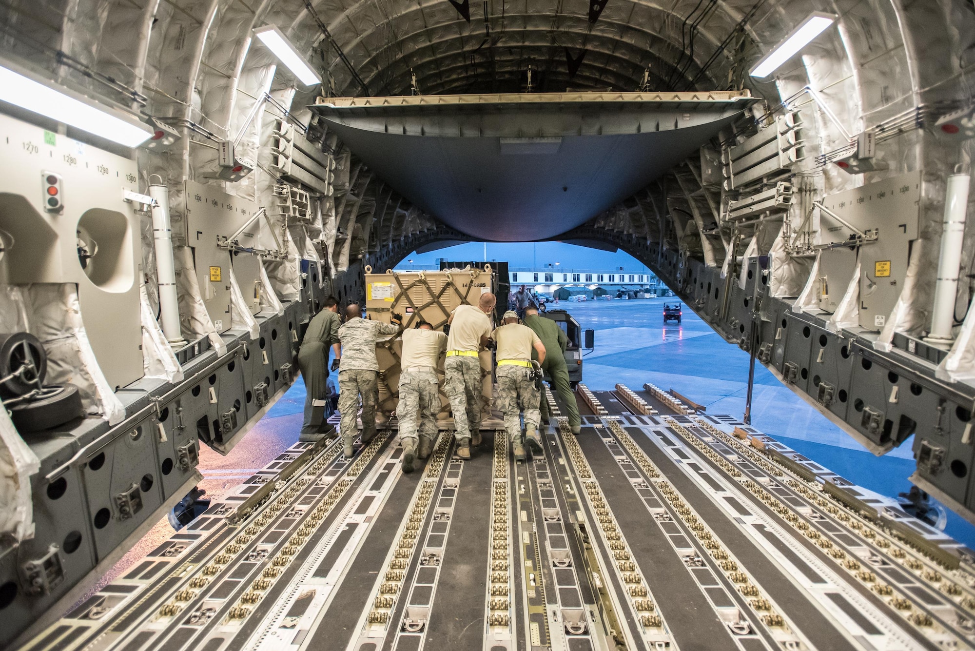 Airmen from the Kentucky Air National Guard’s 123rd Contingency Response Group, augmented by troops from the active-duty Air Force and Air National Guard units in multiple states, dowload relief supplies from aircraft around the clock at Luis Muñoz Marín International Airport in San Juan, Puerto Rico, in the wake of Hurricane Maria Oct. 6, 2017. The unit’s Airmen established an aerial port of debarkation upon arrival here Sept. 23, and have processed more than 7.2 million pounds of cargo and humanitarian aid for distribution in the first three weeks of the operation. (U.S. Air National Guard photo by Lt. Col. Dale Greer)