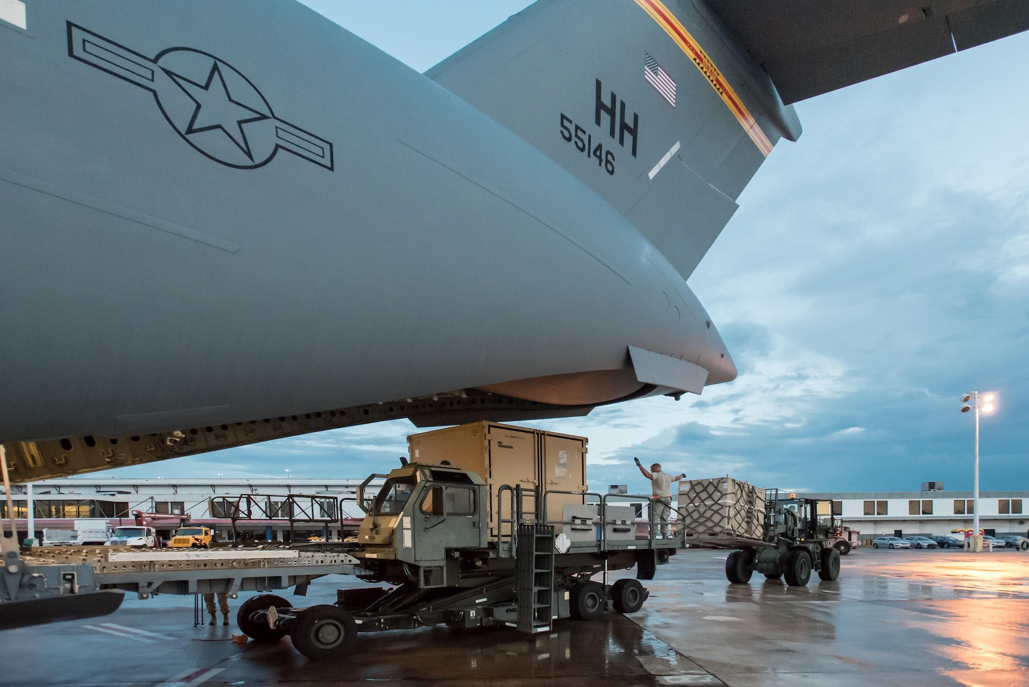 Airmen from the Kentucky Air National Guard’s 123rd Contingency Response Group, augmented by troops from the active-duty Air Force and Air National Guard units in multiple states, dowload relief supplies from aircraft around the clock at Luis Muñoz Marín International Airport in San Juan, Puerto Rico, in the wake of Hurricane Maria Oct. 6, 2017. The unit’s Airmen established an aerial port of debarkation upon arrival here Sept. 23, and have processed more than 7.2 million pounds of cargo and humanitarian aid for distribution in the first three weeks of the operation. (U.S. Air National Guard photo by Lt. Col. Dale Greer)