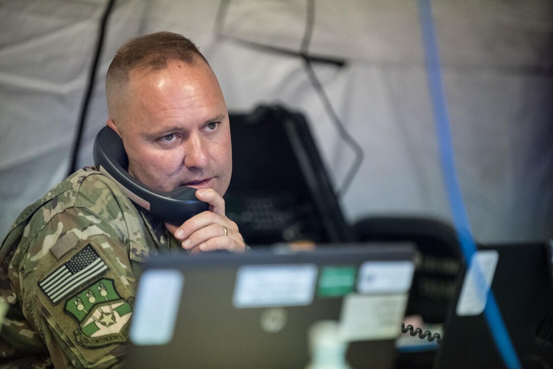 Maj. James Embry, director of operations for the Kentucky Air National Guard’s 123rd Contingency Response Group, coordinates the arrival of military aircraft carrying humanitarian aid into Luis Muñoz Marín International Airport in San Juan, Puerto Rico, on Oct. 7, 2017. More than 7.2 million pounds of relief supplies for Hurricane Maria have arrived here since Sept. 23. (U.S. Air National Guard photo by Lt. Col. Dale Greer)