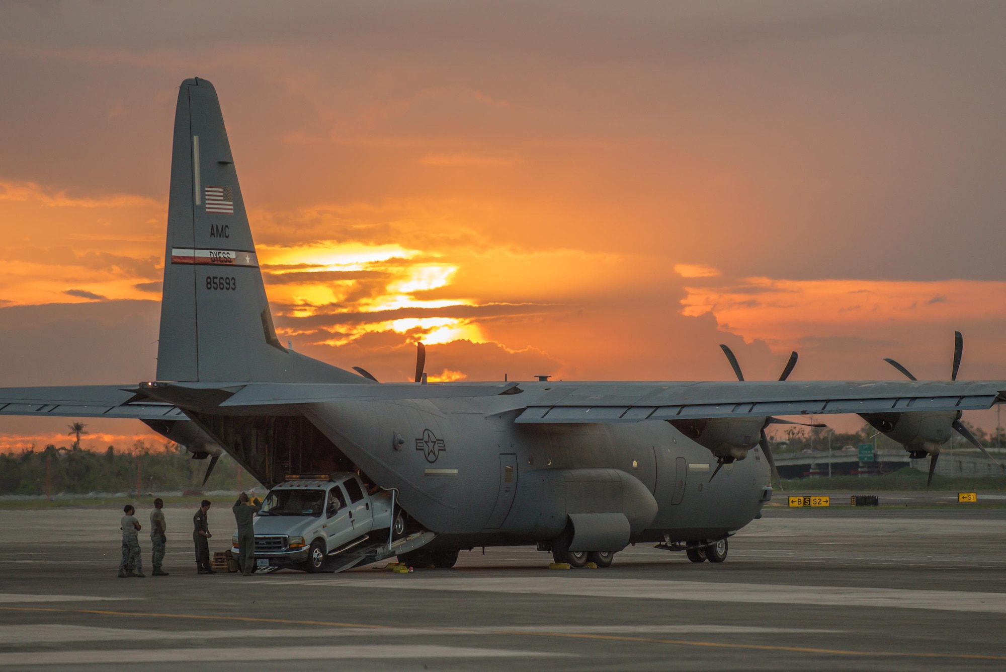 Airmen from the Kentucky Air National Guard’s 123rd Contingency Response Group, augmented by troops from the active-duty Air Force and Air National Guard units in multiple states, dowload relief equipment from a C-130 Hercules aircraft at Luis Muñoz Marín International Airport in San Juan, Puerto Rico, in the wake of Hurricane Maria Oct. 6, 2017. The unit’s Airmen established an aerial port of debarkation upon arrival here Sept. 23, and have processed more than 7.2 million pounds of cargo and humanitarian aid for distribution in the first three weeks of the operation. (U.S. Air National Guard photo by Lt. Col. Dale Greer)