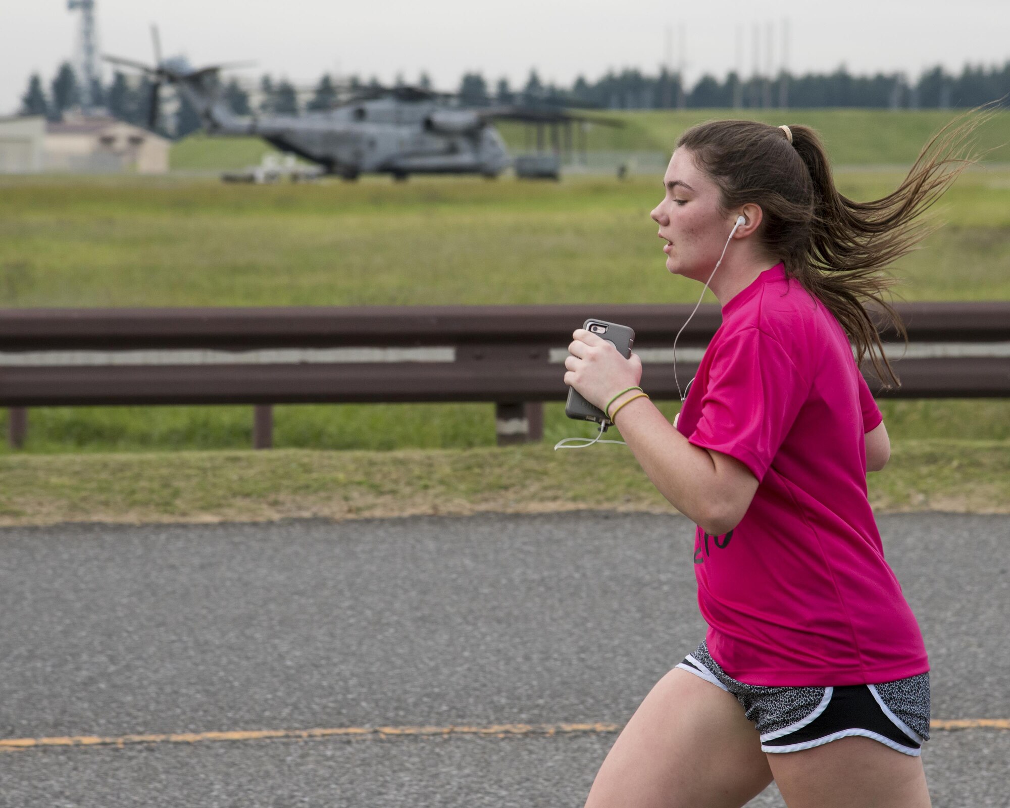 A participant runs during the Breast Cancer Awareness Month 5K run at Yokota Air Base, Japan, Oct. 06, 2017.