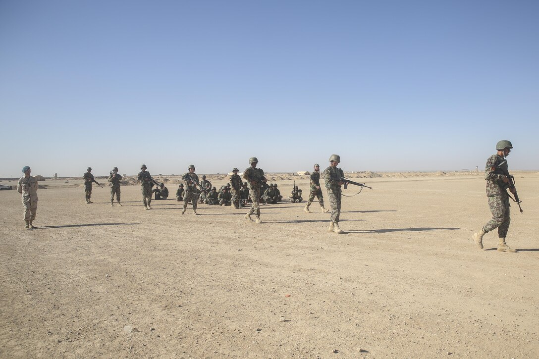 Afghan National Army soldiers with 6th Kandak, 1st Brigade, 215th Corps conduct a mock patrol during infantry tactics training at Camp Shorabak, Afghanistan, Oct. 15, 2017. Afghan instructors at the Helmand Regional Military Training Center are building the warfighting capabilities of more than 300 soldiers assigned to 6th Kandak, 1st Brigade throughout an operational readiness cycle. The ORC is an eight-week training regimen designed to prepare its students for future combat operations throughout Helmand province. (U.S. Marine Corps photo by Sgt. Lucas Hopkins)