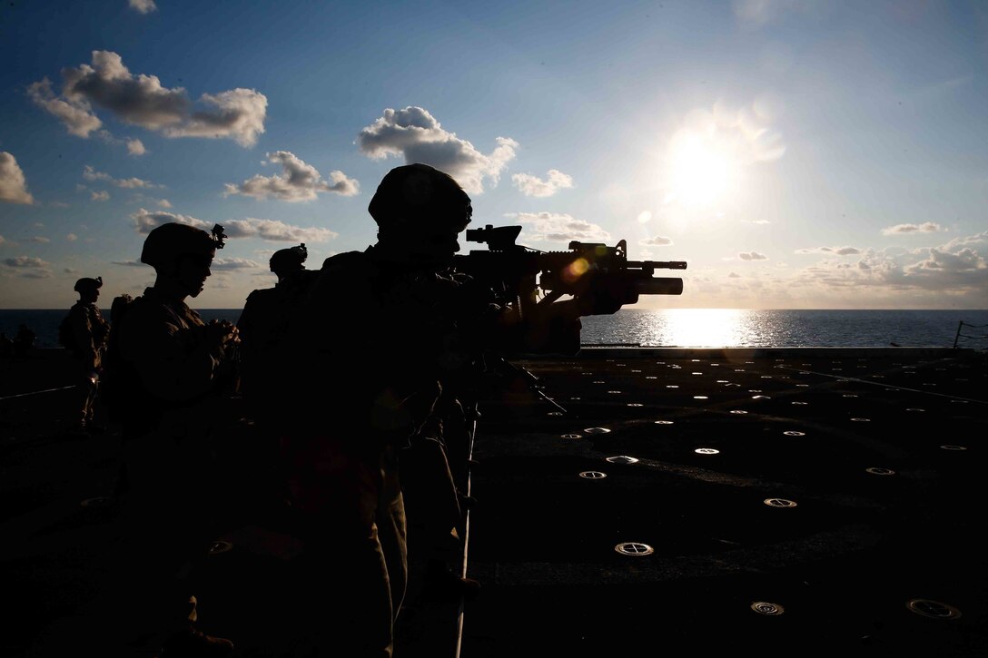 Marines assigned to the 15th Marine Expeditionary Unit’s Battalion Landing Team, 1st Battalion, 5th Marine Regiment, fire at targets during a deck shoot aboard the San Antonio-class amphibious transport dock ship USS San Diego, Oct. 11, 2017. The 15th MEU perform deck shoots to remain proficient with their weapons and be prepared as a maritime crisis-contingency force. San Diego is deployed with the America Amphibious Ready Group and 15th MEU to support maritime security operations and theater security cooperation efforts in the U.S. 6th Fleet area of operations.