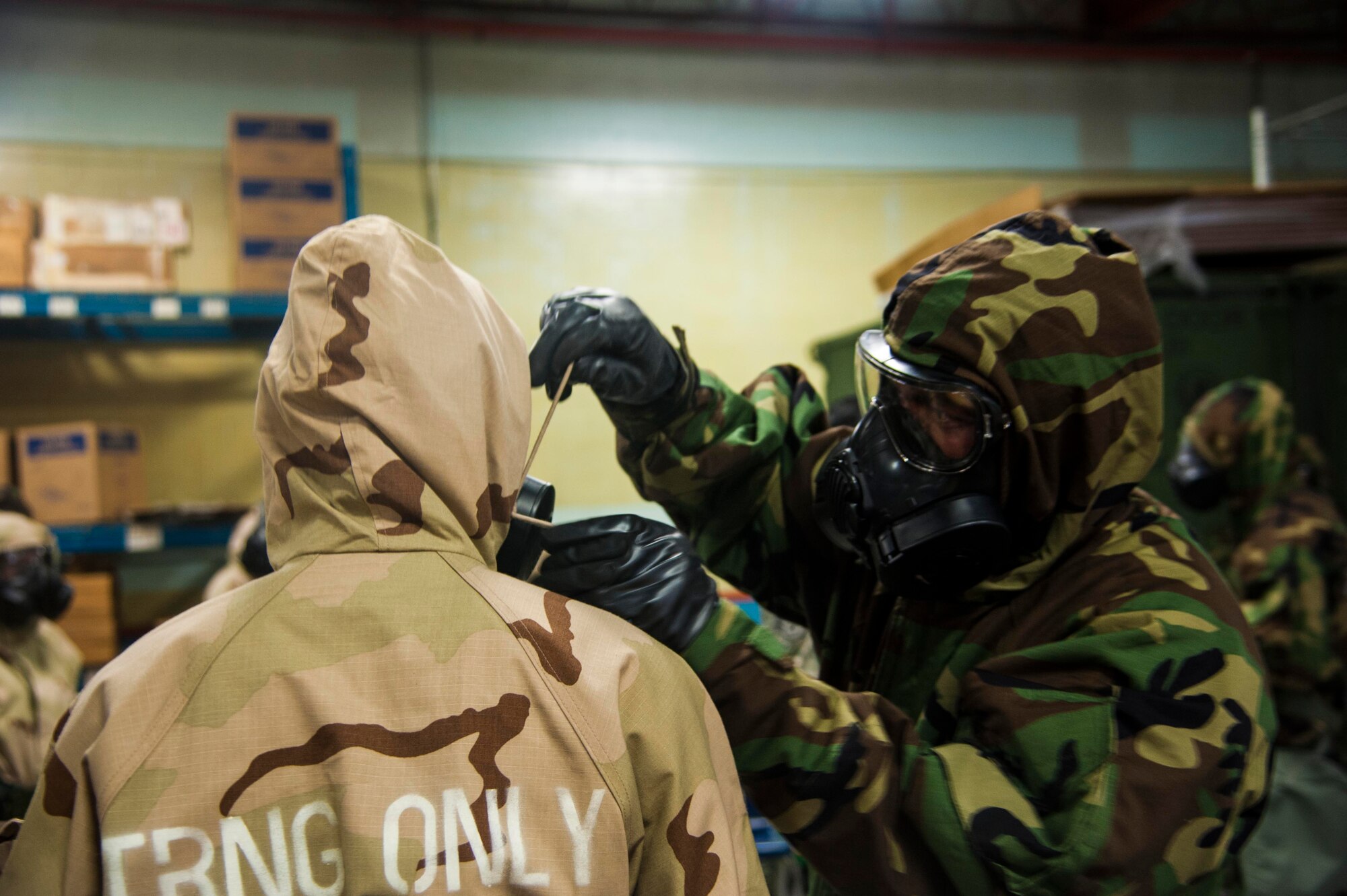 Airmen assigned to the 927th Air Refueling Wing don their Mission-Oriented Protective Posture gear during the Ability to Survive and Operate exercise on Oct. 15, 2017 at MacDill Air Force Base, FL. The ATSO exercise tested the ability of Airmen to determine whether they could still perform their duties while in a chemical warfare atmosphere. (U.S. Air Force photo by Staff Sgt. Xavier Lockley)
