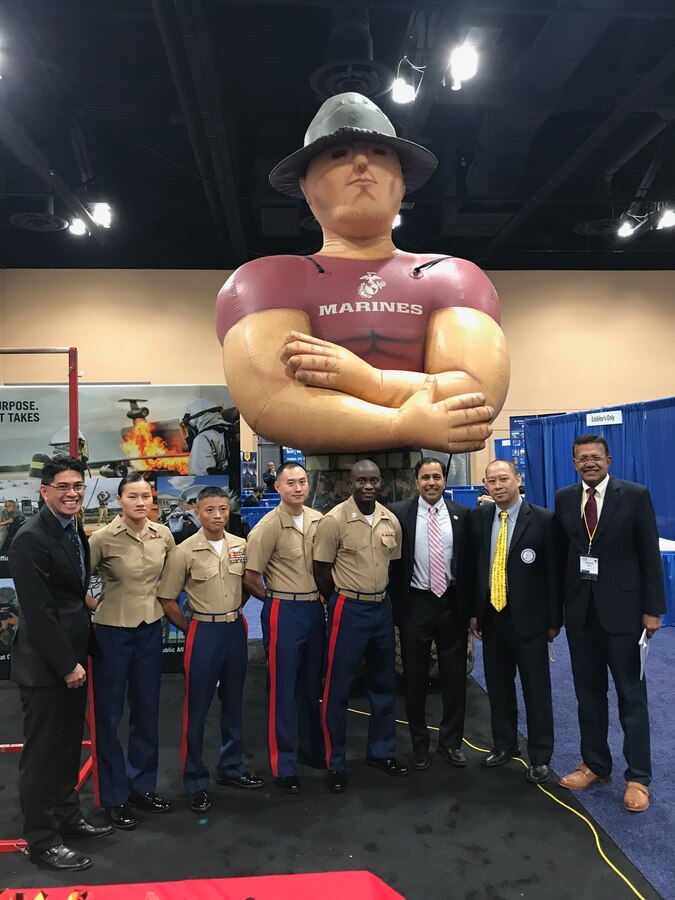 U.S. Marines pose with Subramanian Raja Krishnamoorthi, U.S. representative of Illinois’ 8th congressional district, during the 10th Annual Society of Asian Scientists and Engineers (SASE) National Conference Career Fair in Schaumburg, IL, Oct. 14, 2017. SASE prepares Asian heritage scientists and engineers for success in the global business world while celebrating diversity on campuses and in the workplace providing opportunities for members to make contributions to their local communities.