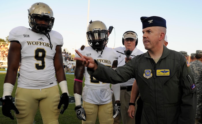 Col. Patrick Winstead, 437th Airlift Wing vice commander, tosses a coin as an honorary captain to determine which team gets possession of the ball at the Johnson Hagood Memorial Stadium for the Citadel’s Military Appreciation Night, Oct. 14, 2017. The 628th Security Forces Squadron and 628th Civil Engineer Squadron Explosive Ordnance Disposal Flight represented Joint Base Charleston at the football game. Additionally, the Citadel hosted women’s soccer and volleyball games in support of Military Appreciation Week. The Citadel Bulldog’s football game against the Wofford Terriers was the capstone event, with Woffard winning 20-16.