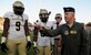 Col. Patrick Winstead, 437th Airlift Wing vice commander, tosses a coin as an honorary captain to determine which team gets possession of the ball at the Johnson Hagood Memorial Stadium for the Citadel’s Military Appreciation Night, Oct. 14, 2017. The 628th Security Forces Squadron and 628th Civil Engineer Squadron Explosive Ordnance Disposal Flight represented Joint Base Charleston at the football game. Additionally, the Citadel hosted women’s soccer and volleyball games in support of Military Appreciation Week. The Citadel Bulldog’s football game against the Wofford Terriers was the capstone event, with Woffard winning 20-16.