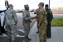 Maj. Gen. Anthony Cotton, 20th Air Force commander, shakes hands with Senior Master Sgt. Shawn Watkins, 40th Helicopter Squadron superintendent, upon his arrival to the 40th HS, Oct. 10, 2017 at Malmstrom Air Force Base, Mont.