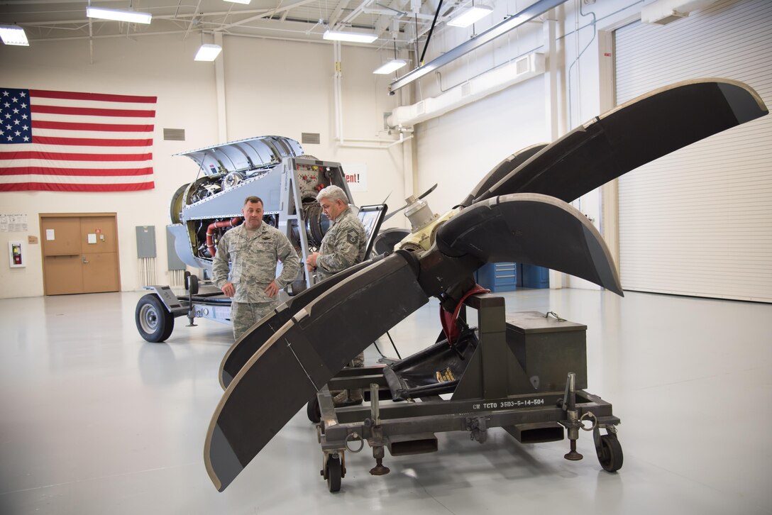 Maj. Gen. Timothy Leahy, 2nd Air Force commander, discusses the mission of the propulsion shop with Senior Master Sgt. Eric Johnson, 403rd Maintenance Squadron superintendent, during his immersion tour of the 403rd Wing Oct. 13, 2017 at Keesler air Force Base, Mississippi. (U.S. Air Force photo/Staff Sgt. Heather Heiney)