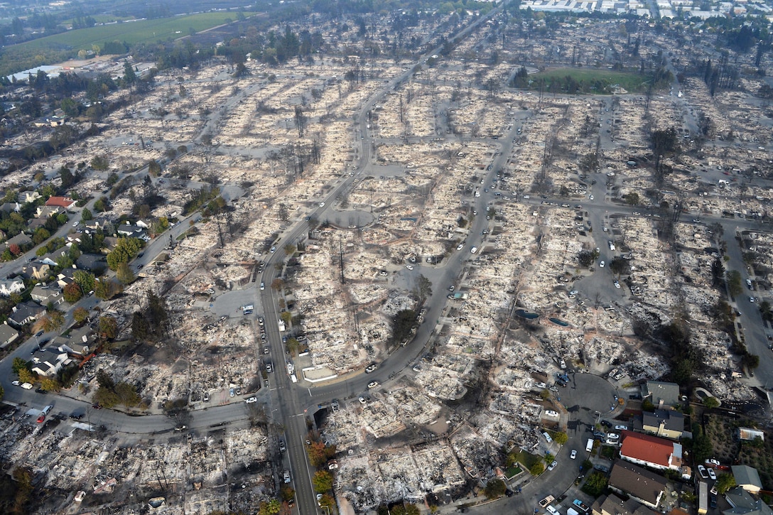 As seen from above, homes and trees are burned.