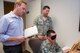 John Heaton (left), Neuropsychiatry Branch manager of the Aeromedical Consultation Service, and Lt. Col. Kevin Heacock, ACS Neuropsychiatry Branch chief, oversee a demonstration of a psychological test on Master Sgt.Walter Croft, the branches NCO in charge and mental health technician. The test is one of several that are administered to waiver candidates to evaluate cognitive functioning. (The test is not revealed here in order to not compromise its effectiveness in the future). (U.S. Air Force photo/John Harrington)