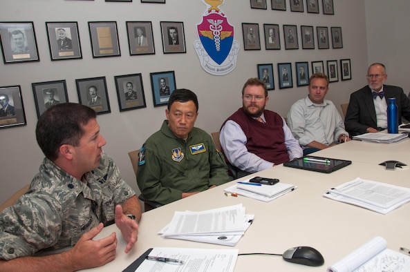 Lt. Col. Kevin Heacock, Neuropsychiatry Branch chief of the Aeromedical Consultation Service, leads discussion on a medical waiver recommendation request case during a branch case review conference October 17. The Neuropsychiatry Branch reviewed 463 cases in 2016 with 80 percent of cases receiving recommendations for medical waivers. (Parts of documents are blurred to protect privacy) (U.S. Air Force photo/John Harrington)